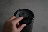 Coffee bean container push-button vacuum seal close up