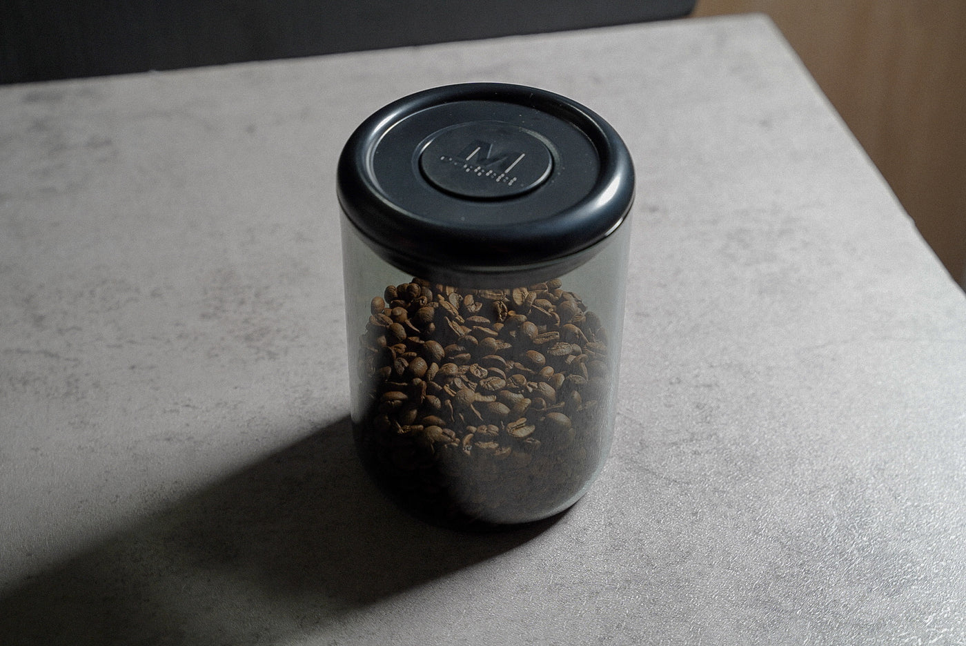 Coffee bean container push-button vacuum seal close up