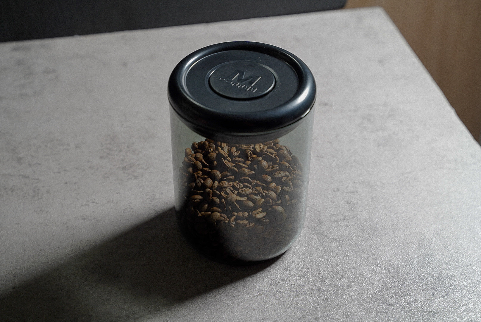 Coffee bean container push-button vacuum seal close up